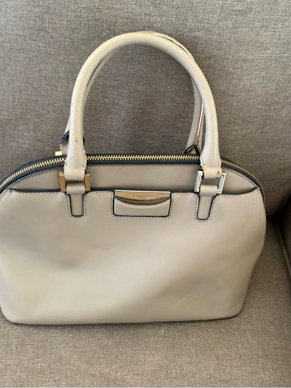 Calvin Klein taupe leather handbag
 13“ x 9 1/2“ x 6“. INV25/518